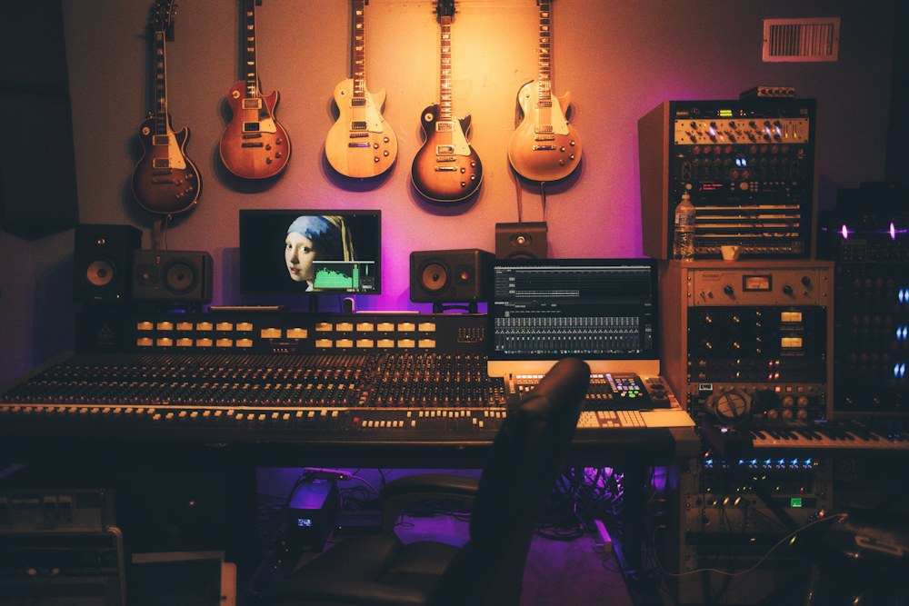 Independent recording studio with guitars and a mixing desk